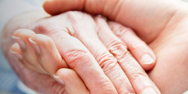 hands holding one younger one older