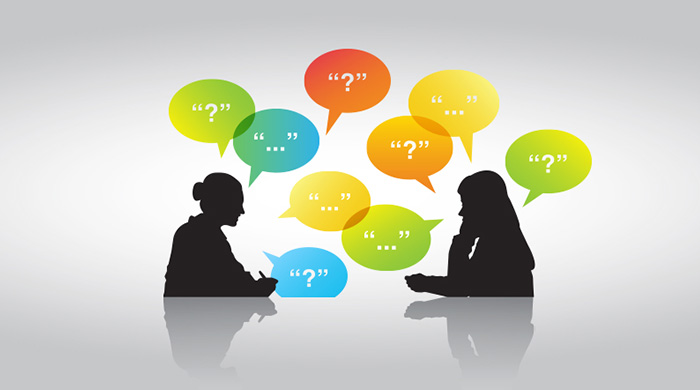 Two people facing each other with question marks in thought bubbles above them.