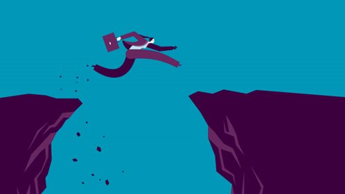 Person leaping between two cliffs.